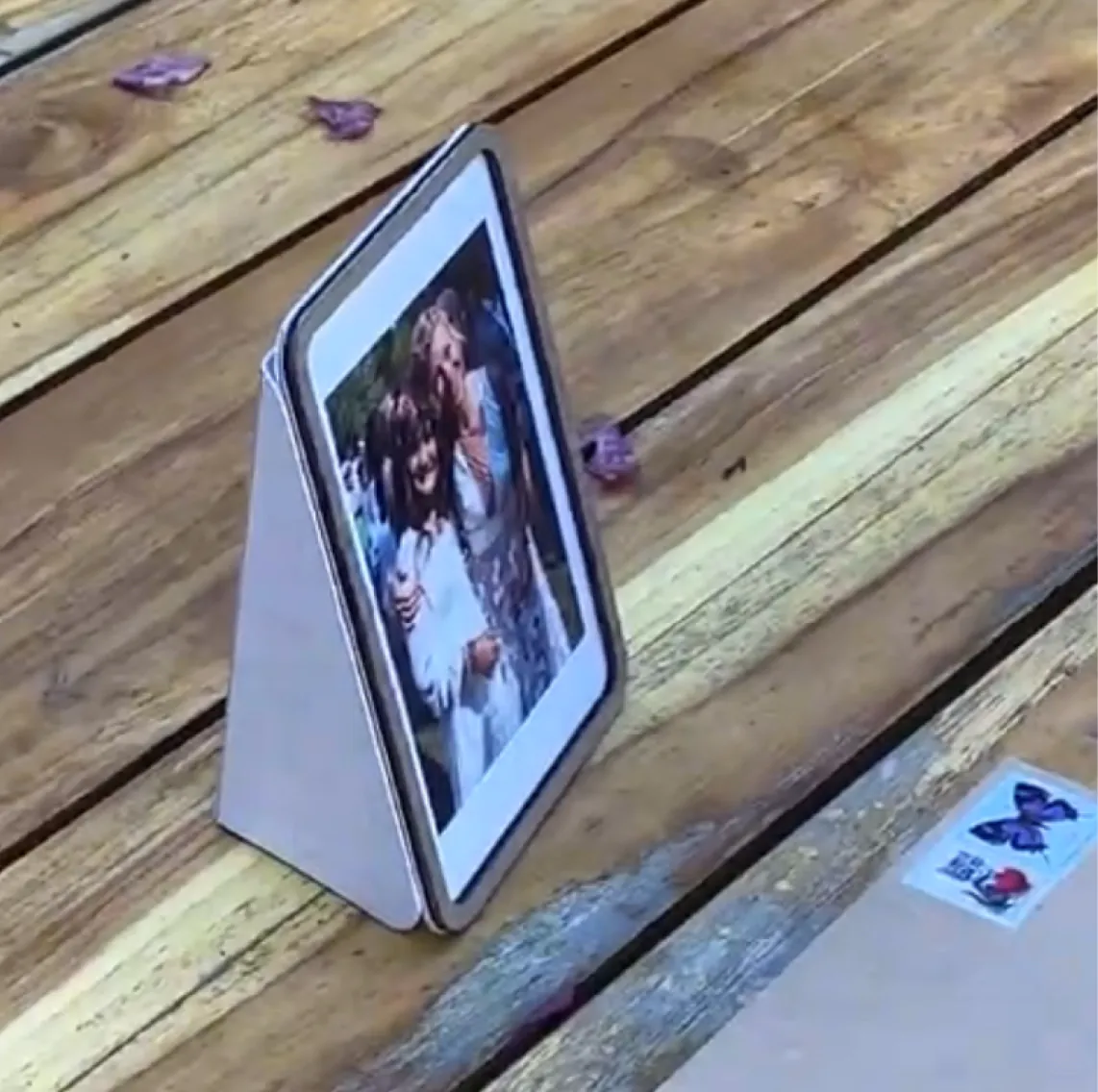 A Pop-up Frame card standing open on a wooden table