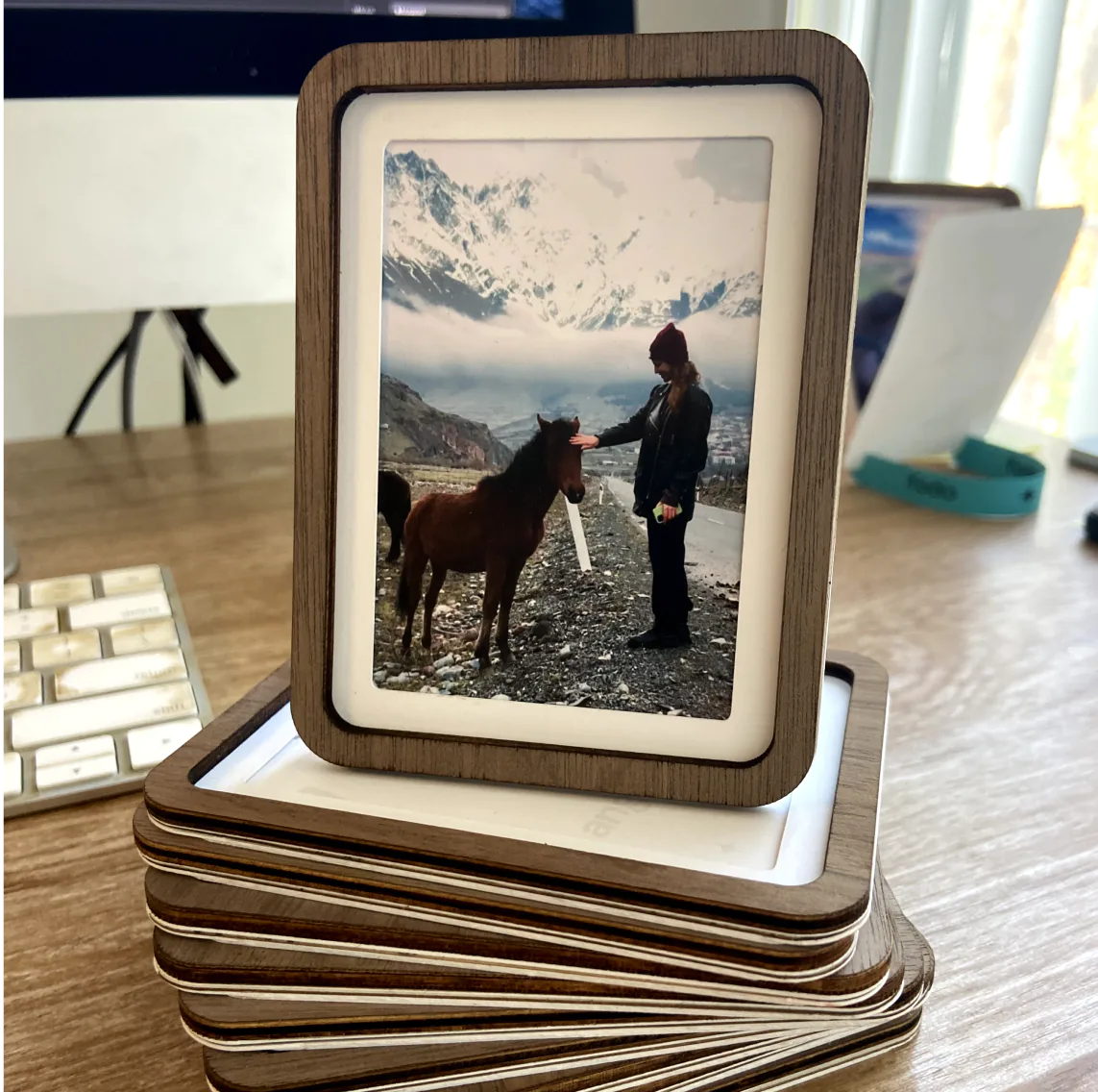 A stack of Pop-up Frames, the top one holding a photo of a horse in the mountains